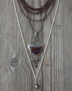 Chandelier drop necklace with bi-colored sapphire bead fringe shown on chain with layer necklaces (not included)