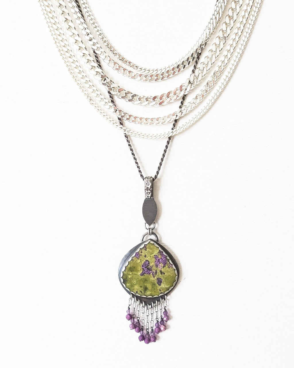 Nature-inspired artisan pendant with vibrant spring colors shown on chain with layer necklace (not included)