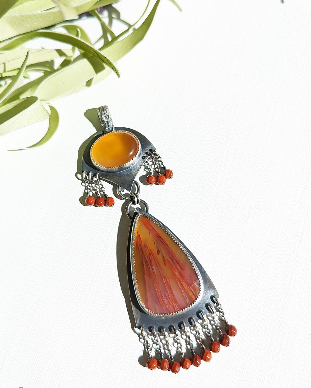 Honey chalcedony and sugar palm root agate two-stone pendant