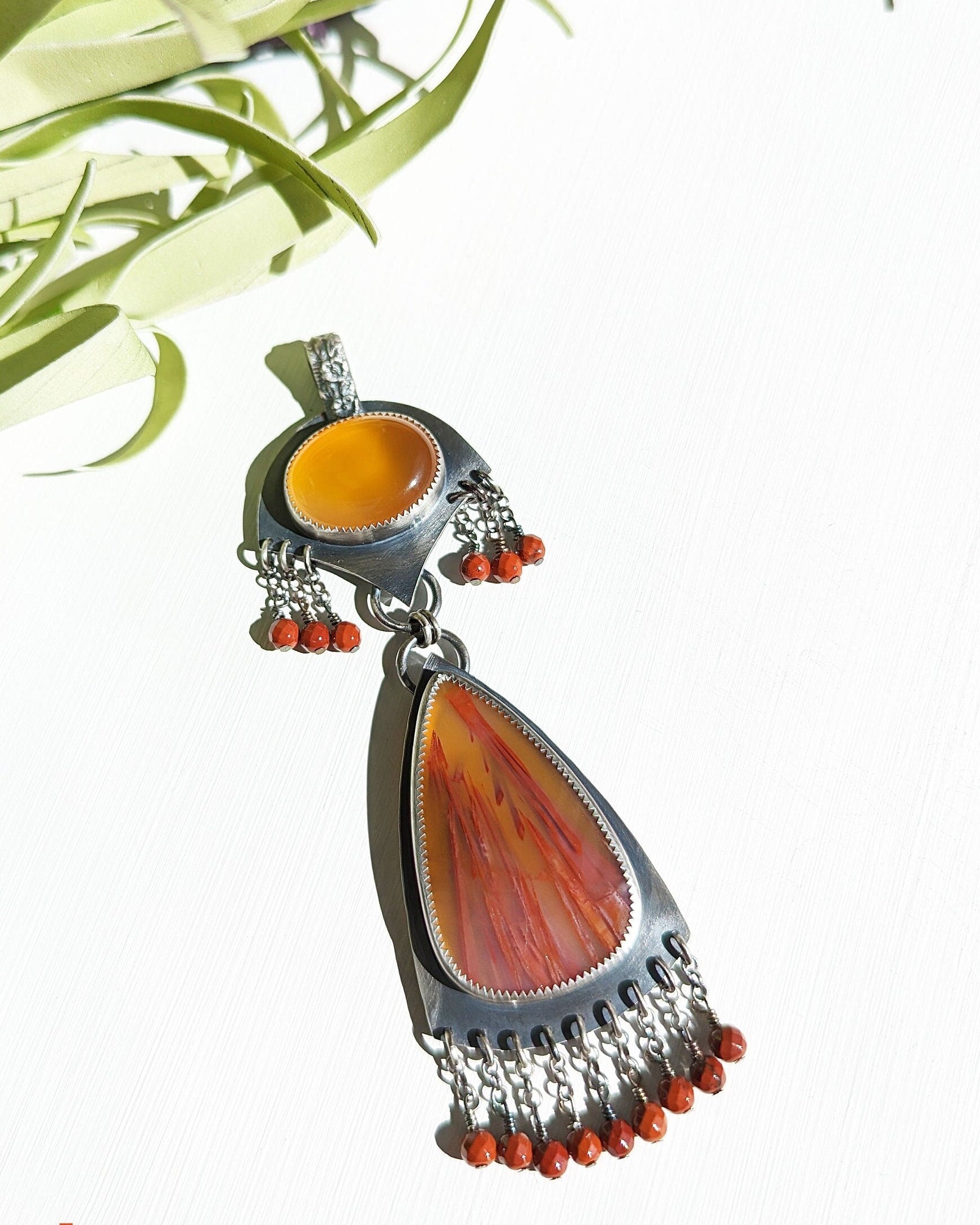 Honey chalcedony and sugar palm root agate two-stone pendant