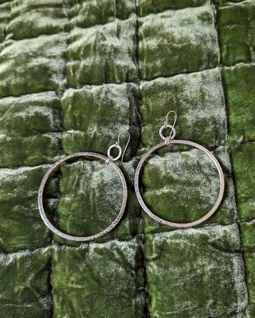 Large hammered sterling silver hoop earrings with minimalist design