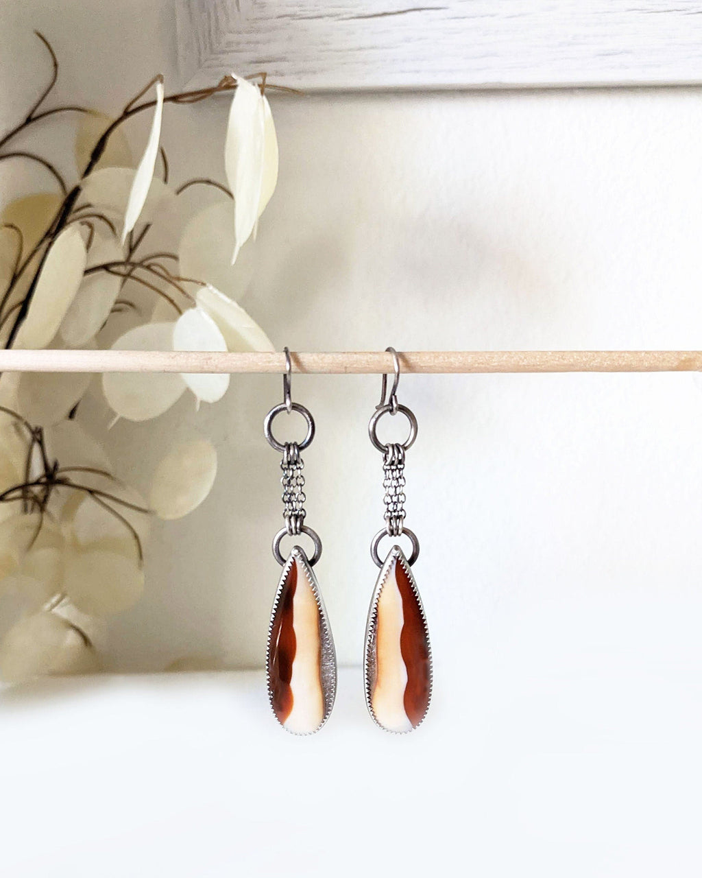 Vertically banded agate earrings with orange-red and cream stripes