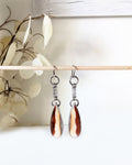 Vertically banded agate earrings with orange-red and cream stripes