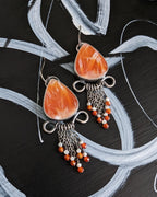Beach-inspired gemstone earrings with cream and orange contrast