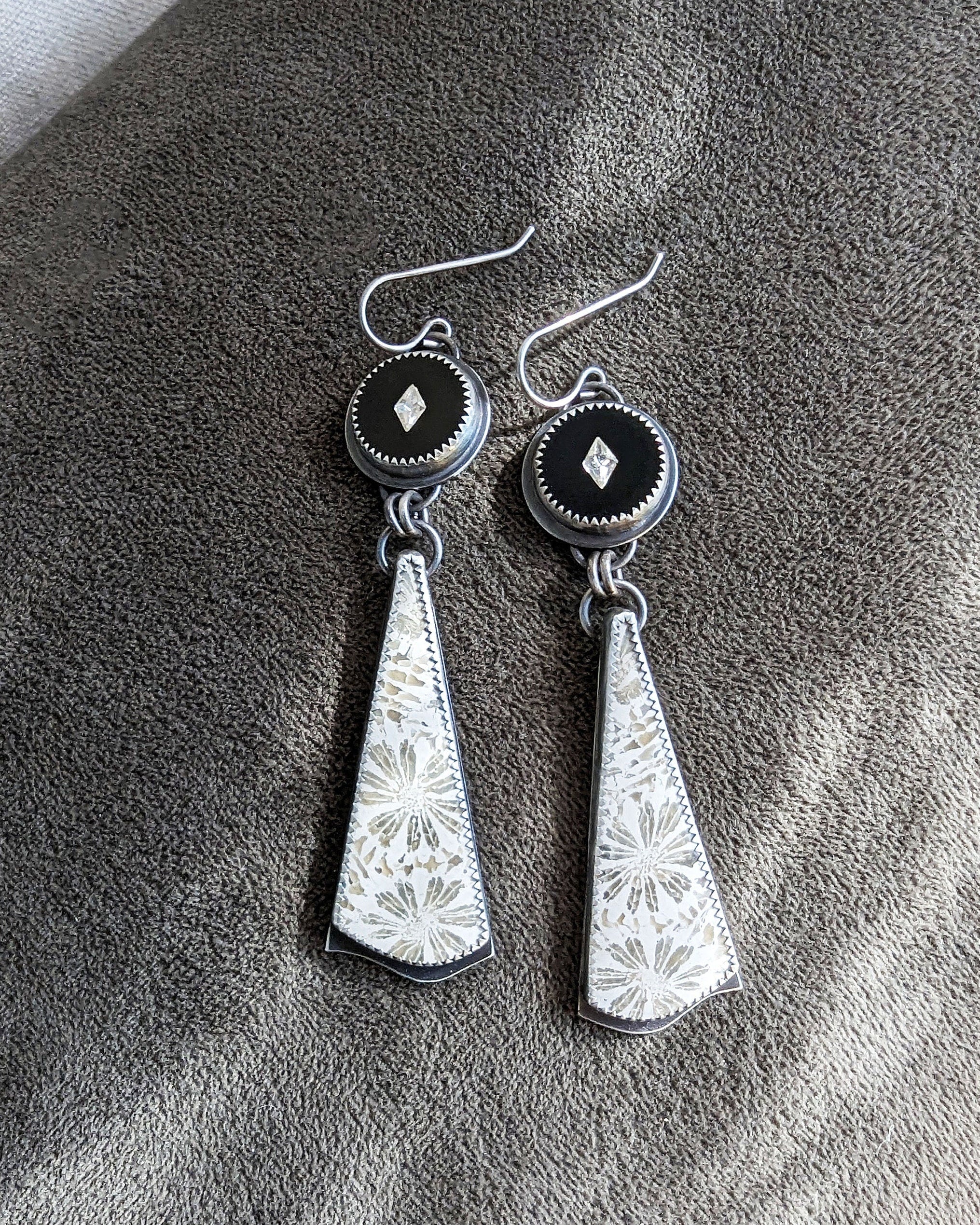 Black and white statement earrings with organic fossil patterning