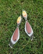 Oxidized sterling silver earrings with cascading silver pyrite bead fringe below red and orange gemstones
