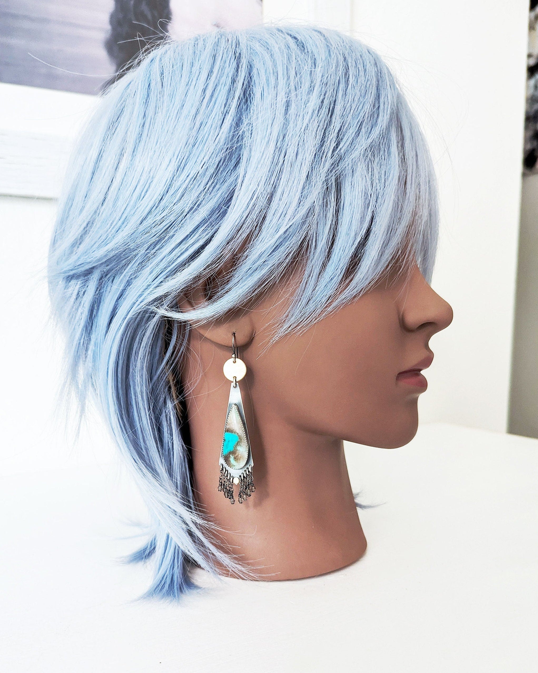 Modern earthy statement earrings with opalized wood gemstone drops on mannequin for scale