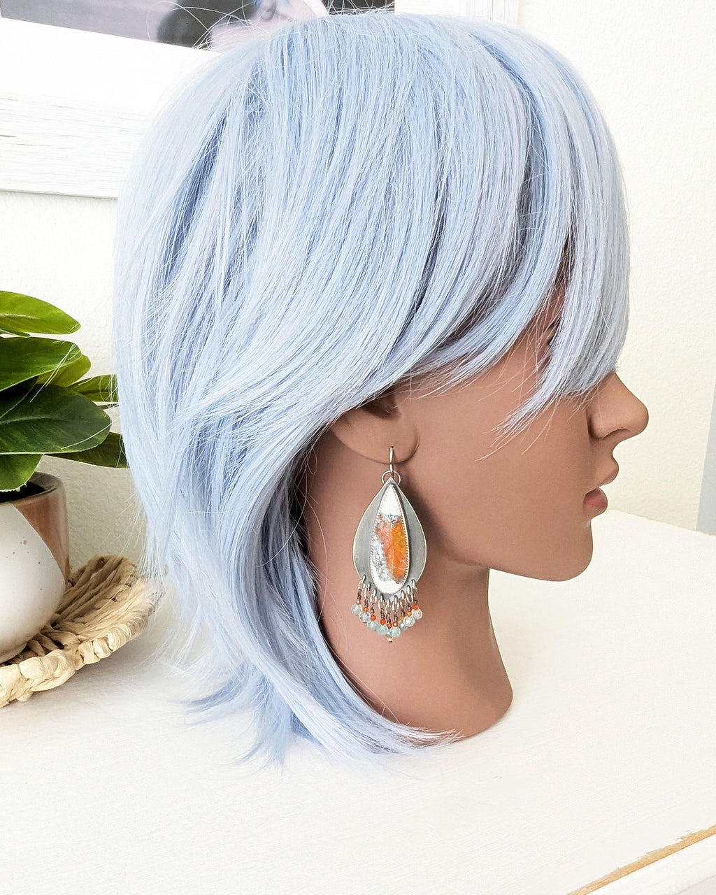 Pale aqua apatite and carnelian bead fringe beneath opal wood stones