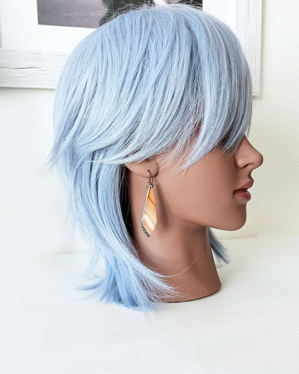 Rustic fall gemstone earrings featuring natural banded agate on mannequin for scale