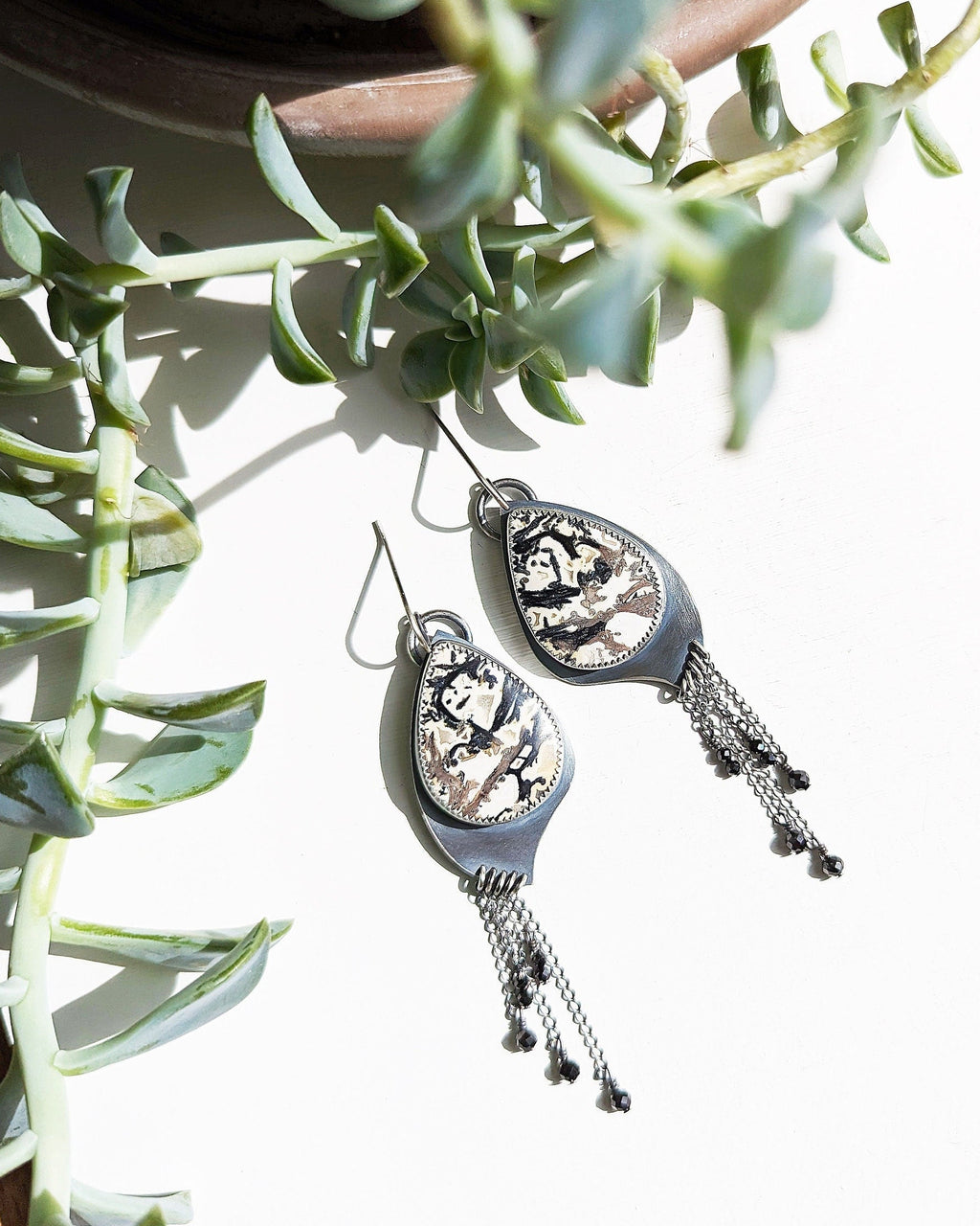 Palm root agate earrings with beige and black natural pattern