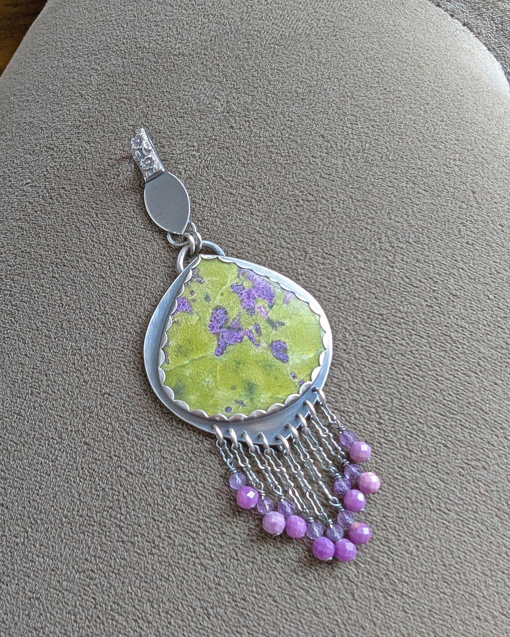 Phosphosiderite and amethyst bead fringe beneath gemstone centerpiece