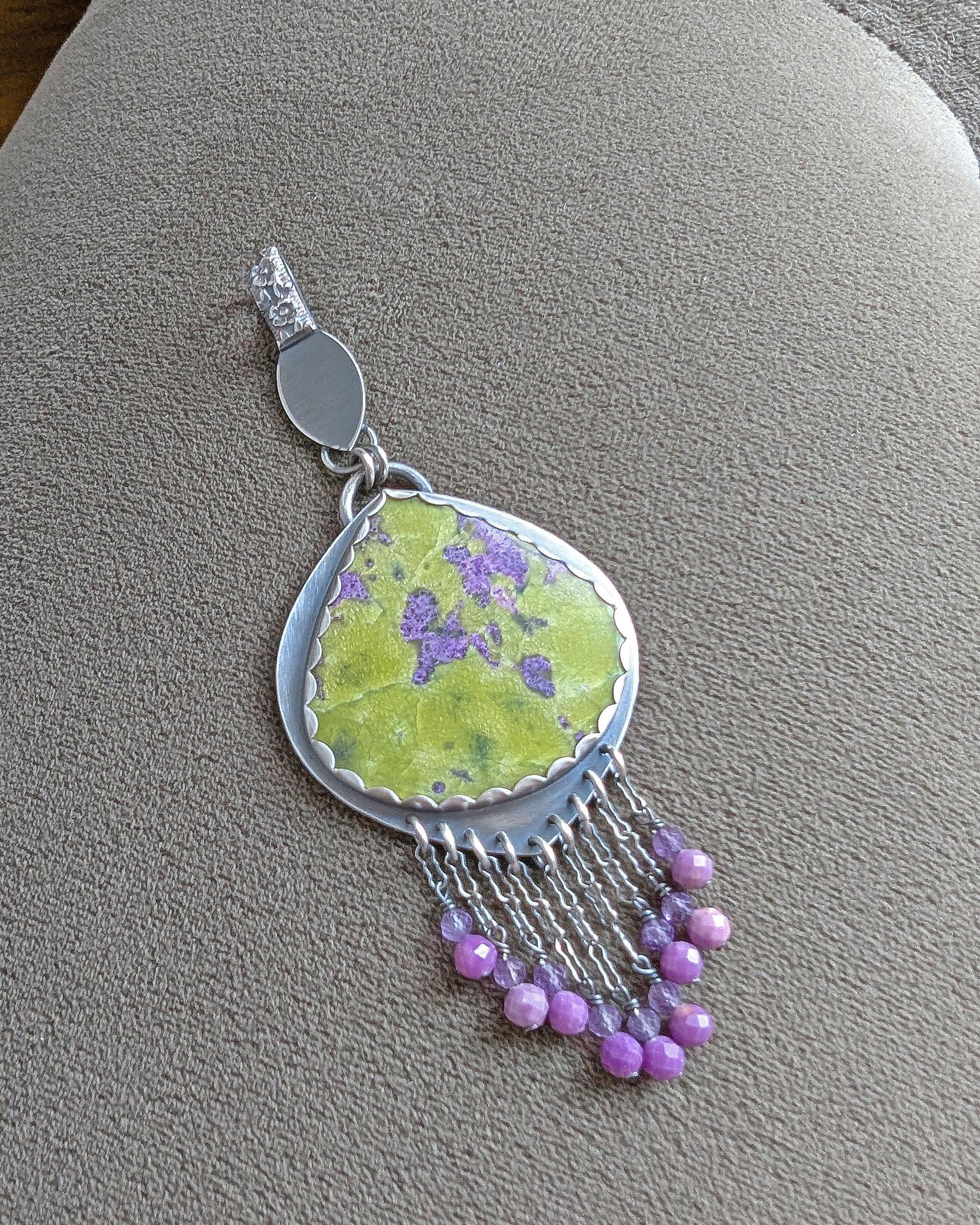 Phosphosiderite and amethyst bead fringe beneath gemstone centerpiece