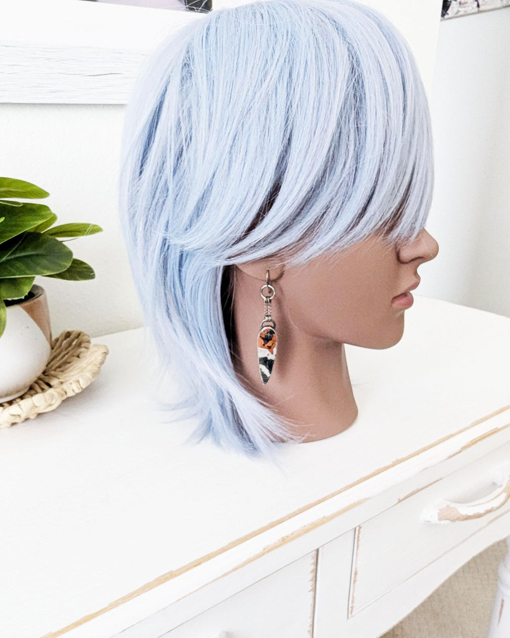 Earthy boho luxe earrings featuring multicolor jasper stones on mannequin for scale