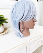 Earthy boho luxe earrings featuring multicolor jasper stones on mannequin for scale