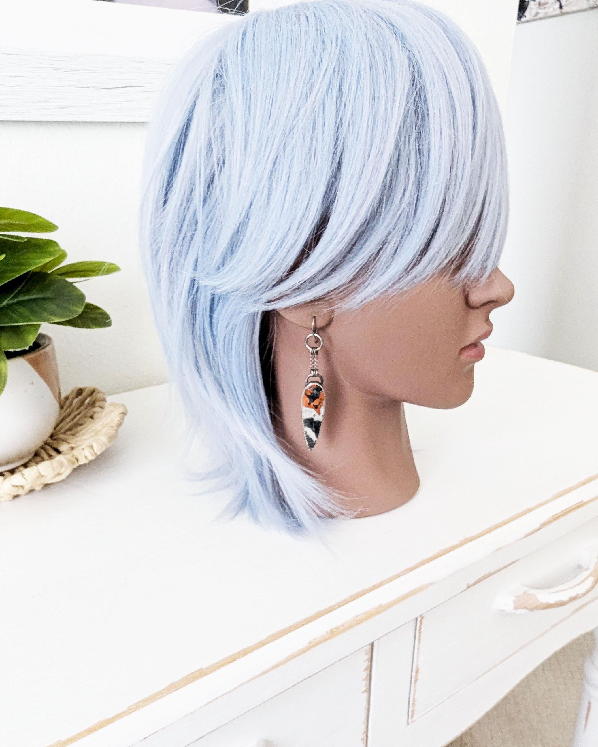 Earthy boho luxe earrings featuring multicolor jasper stones on mannequin for scale