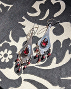 Rose cut garnet earrings with deep red gemstone center in oxidized sterling silver