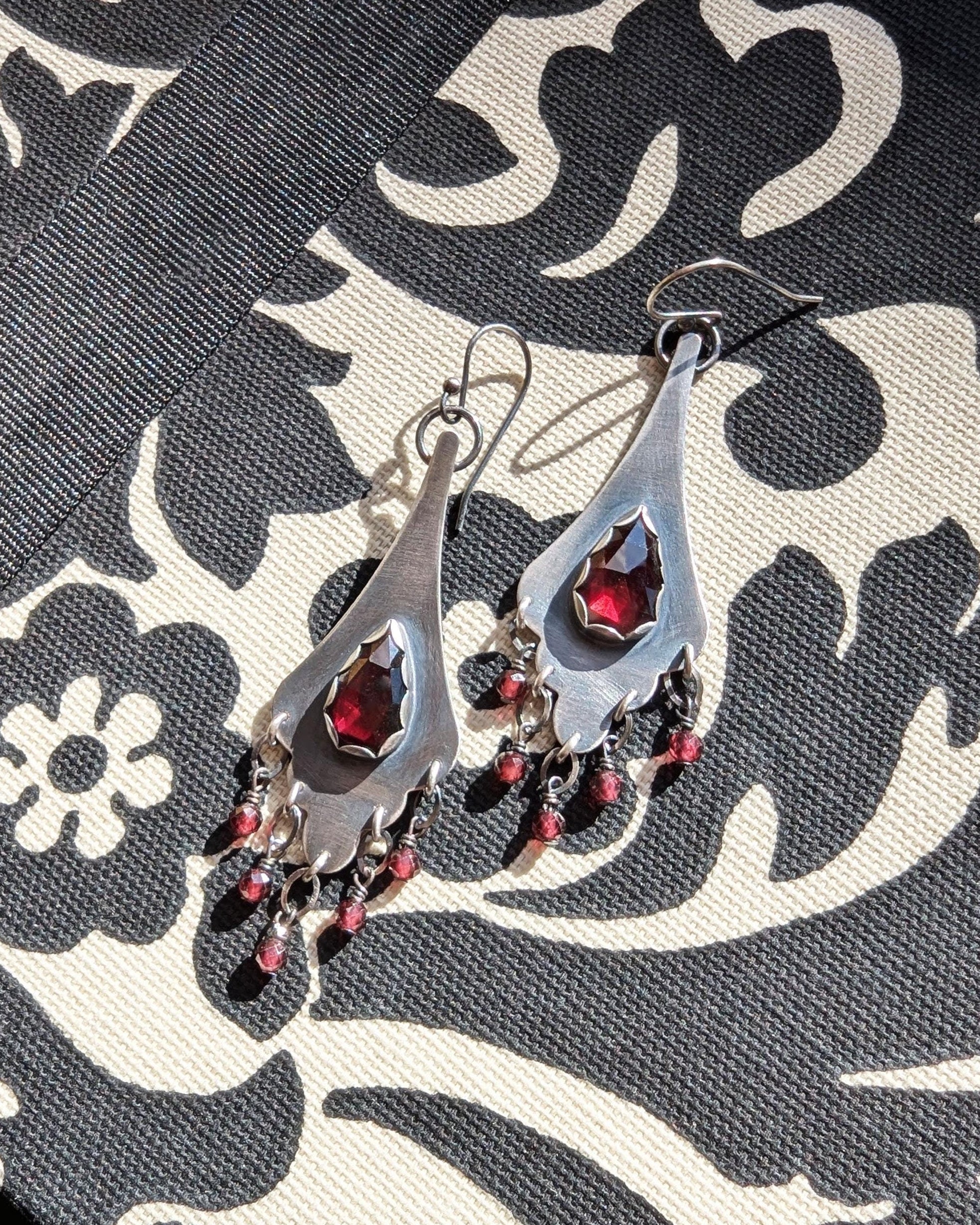 Rose cut garnet earrings with deep red gemstone center in oxidized sterling silver