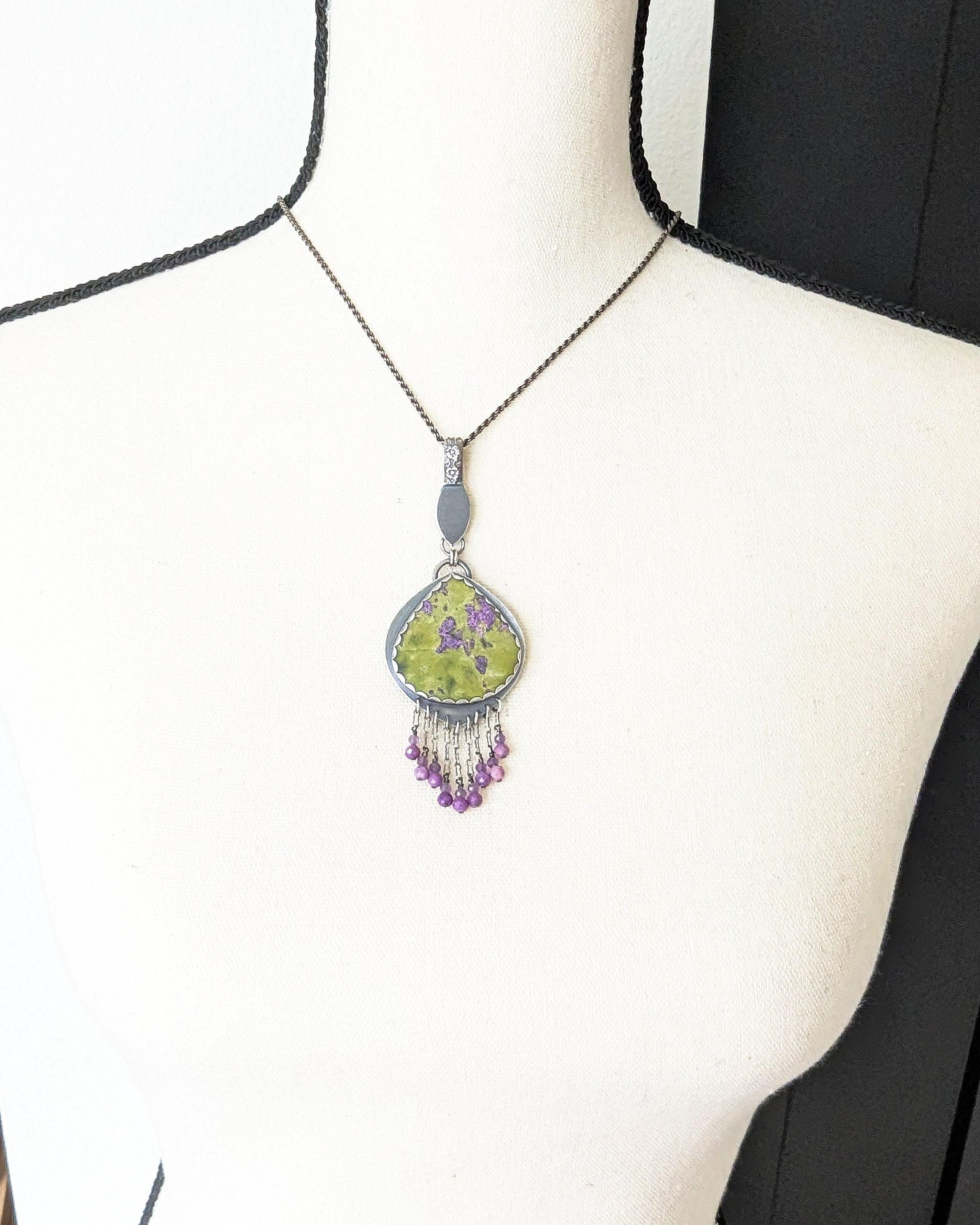 Large statement necklace featuring natural atlantisite on bust for scale
