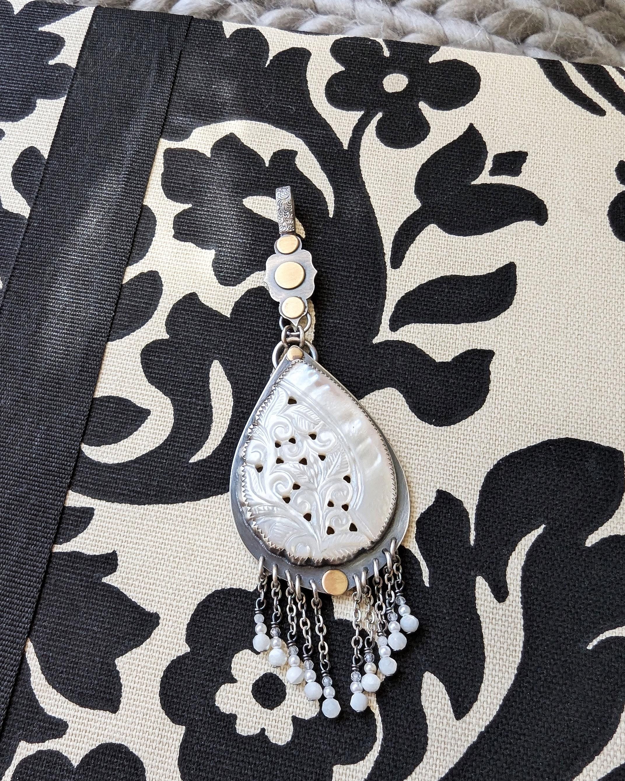 Boho pendant with cascading mother of pearl, glass beads, and moonstone fringe