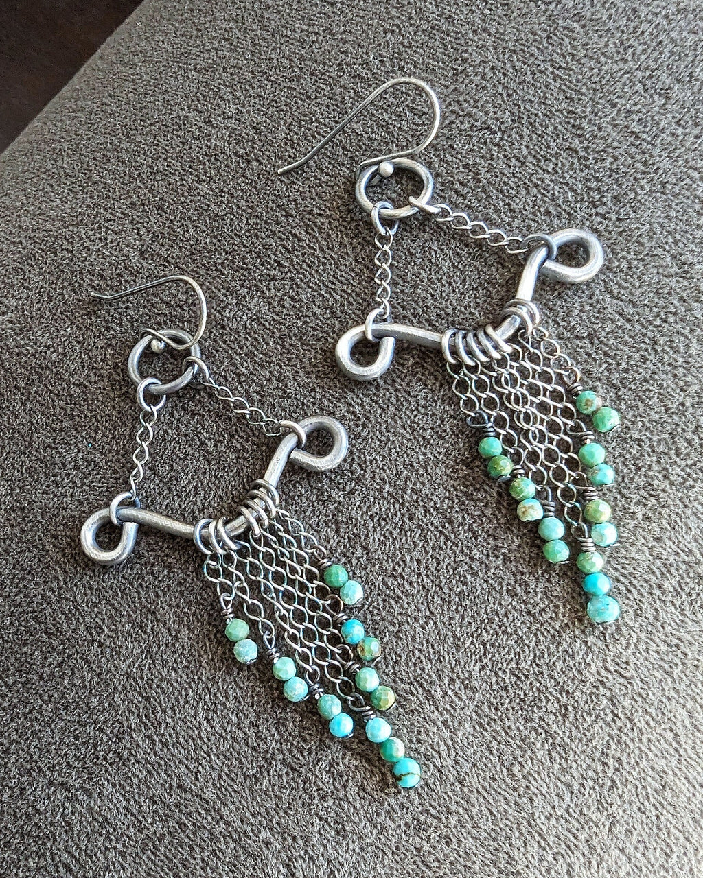 Artisan filigree drop earrings with flowing silver chain detail