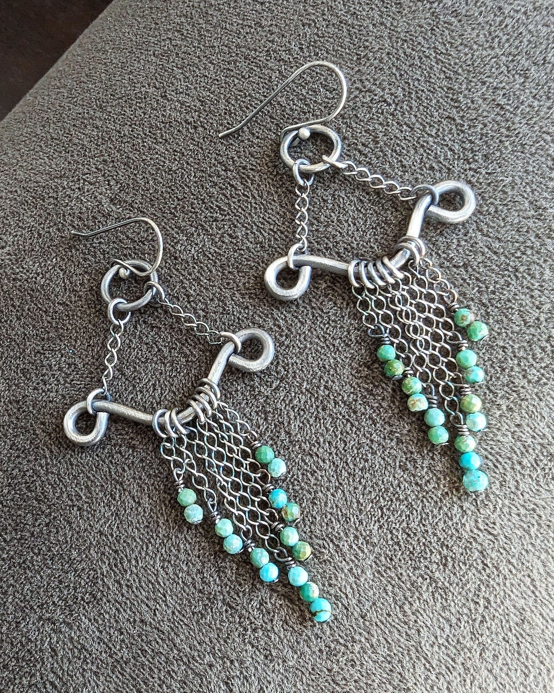 Artisan filigree drop earrings with flowing silver chain detail