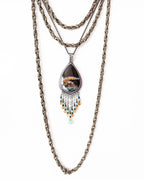 Artisan sterling silver necklace with warm autumn ocean hues shown on chain with layering necklace (not included)