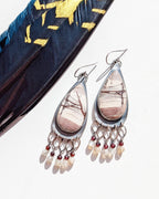 Pear-shaped sterling silver frame with earthy mauve rhyolite jasper