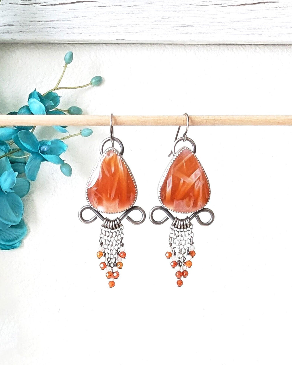 Petrified sugar palm agate earrings in mango orange tones