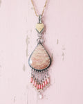 Pink coral and rose quartz bead fringe beneath fossil stone on chain (not included)