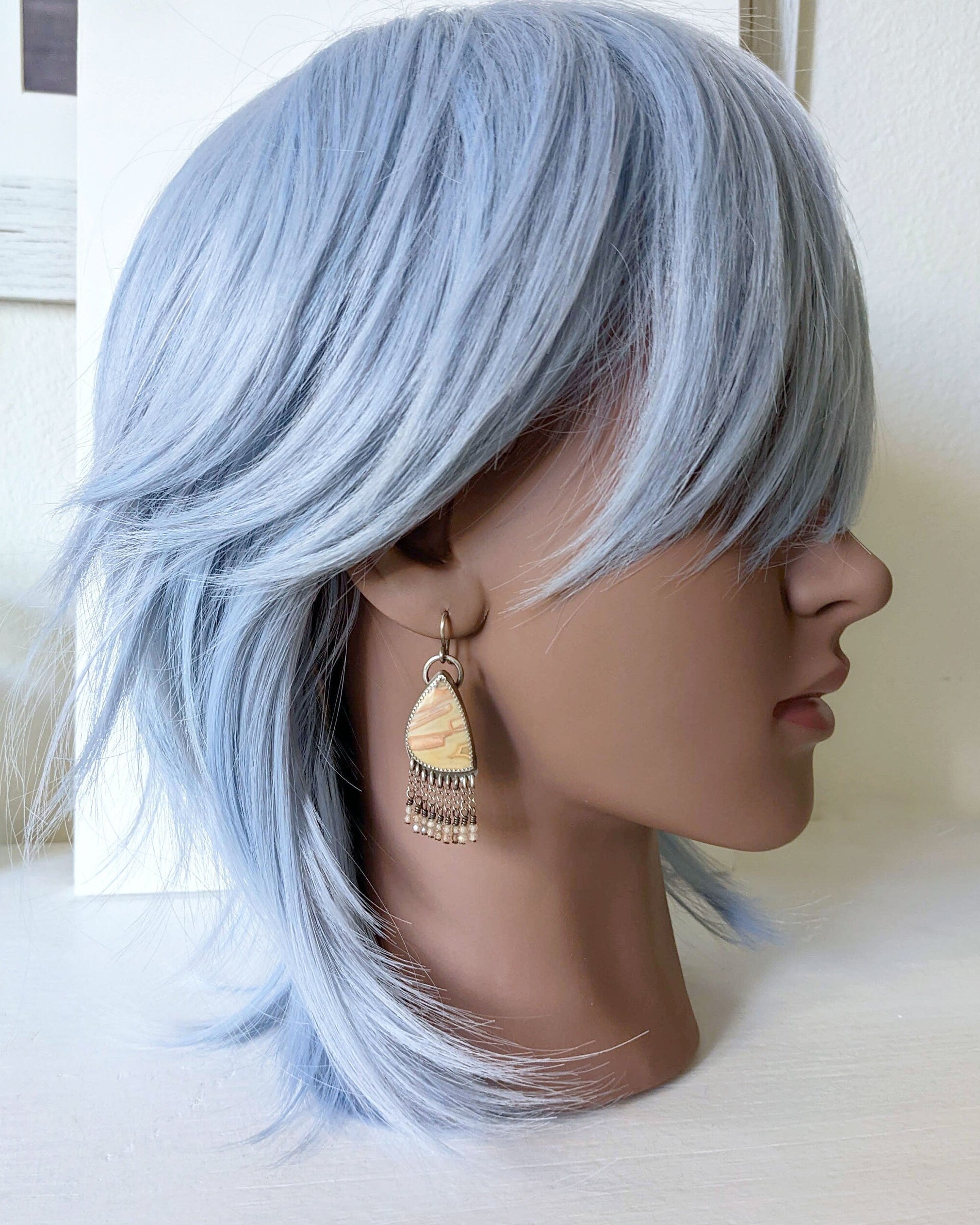 Mediumweight statement earrings with banded agate and delicate zircon fringe shown on mannequin for size