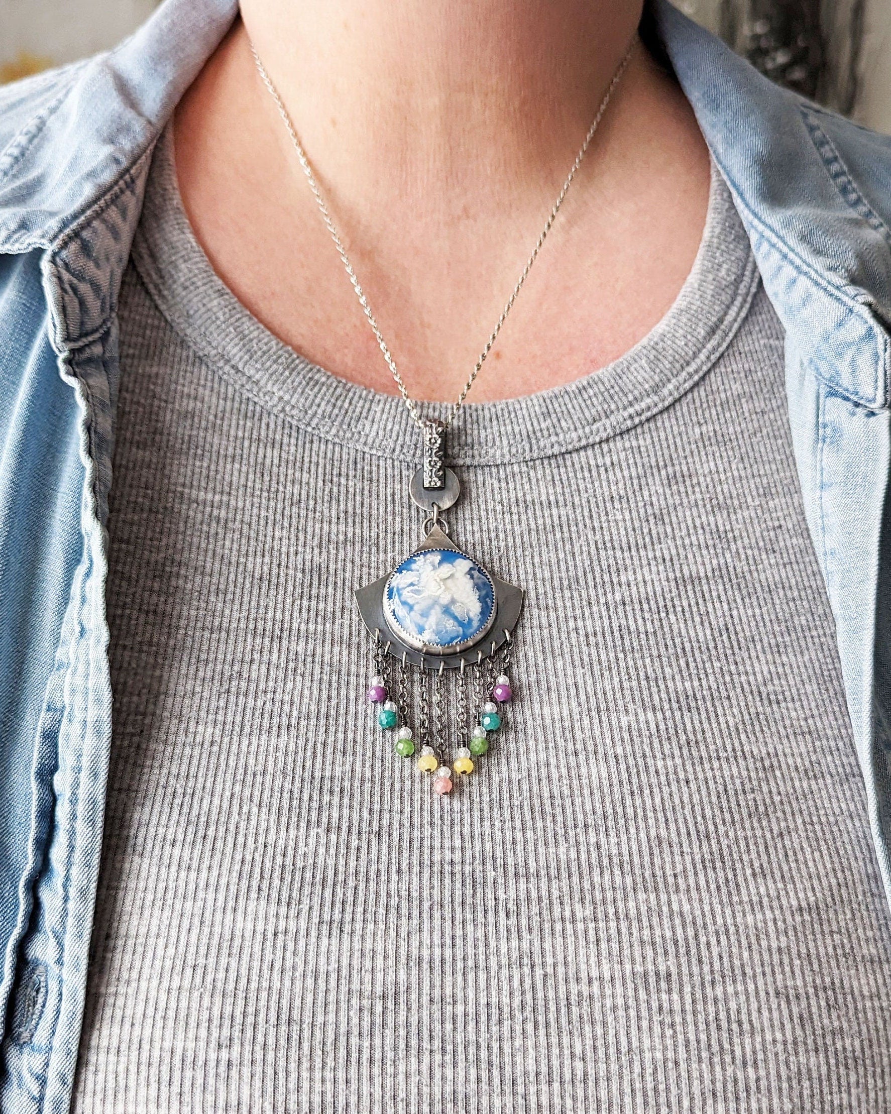 Artisan necklace with lavender, aqua, and pink gemstone accents on bust for scale
