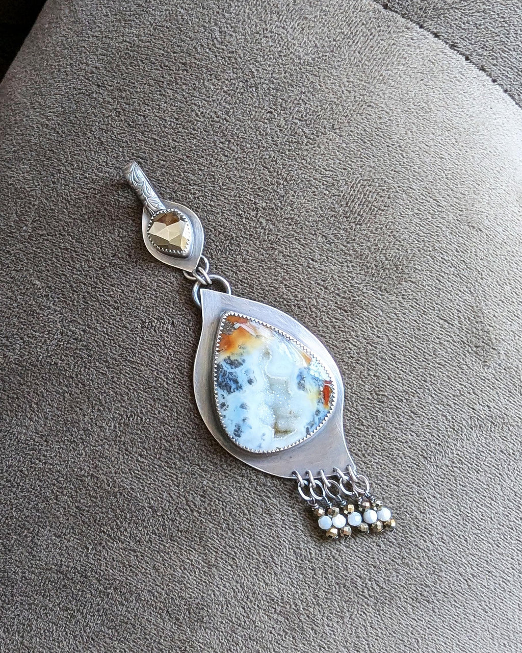 Marcasite druzy agate pendant with red and orange swirling tones