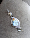 Marcasite druzy agate pendant with red and orange swirling tones