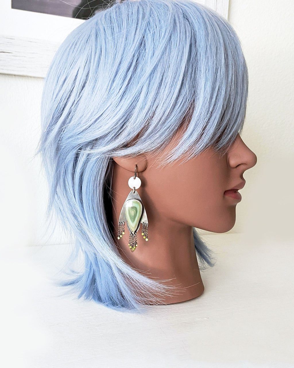 Pastel desert inspired jasper earrings in oxidized sterling silver on mannequin for scale