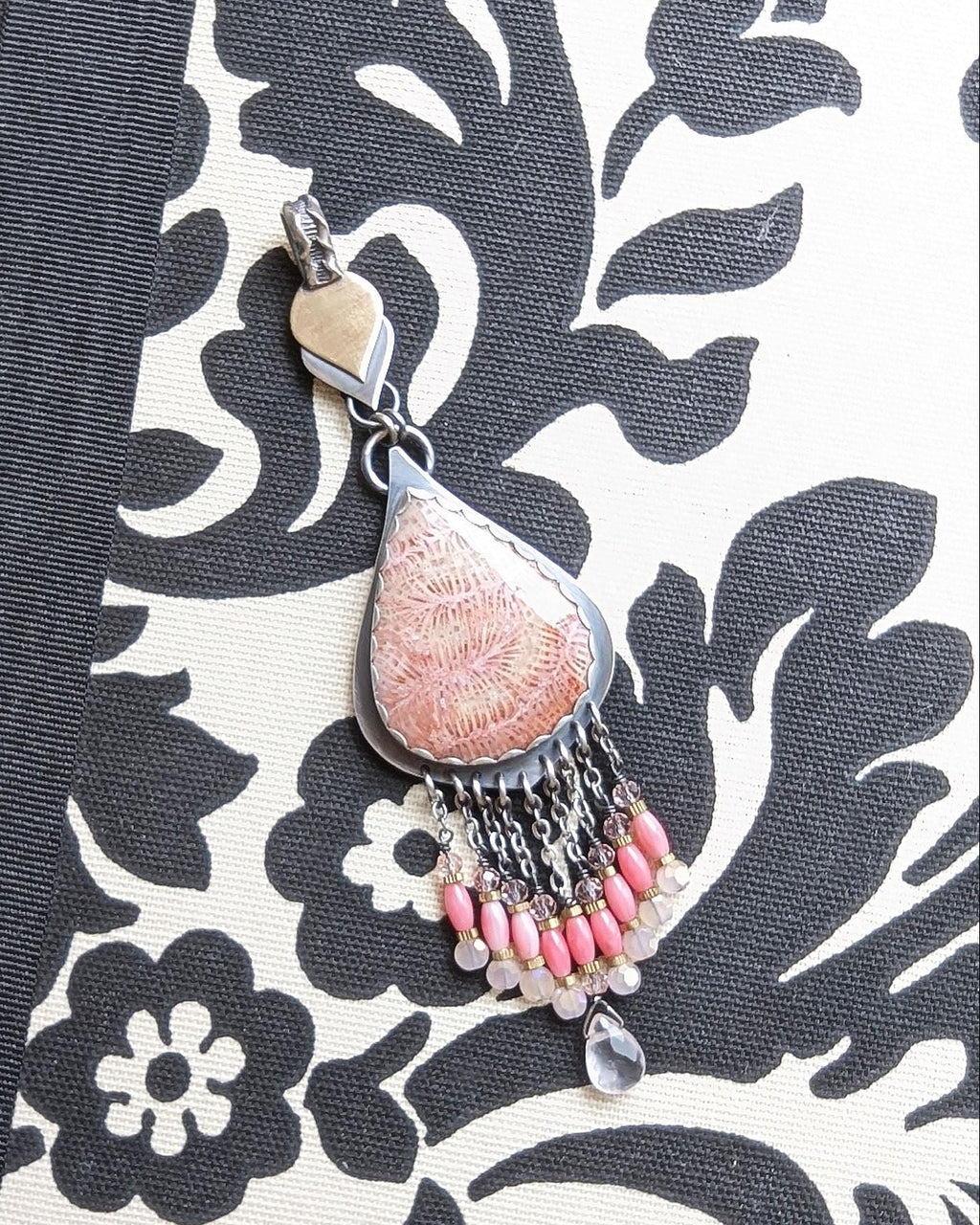 Fossil coral pendant with peach and cream pastel tones