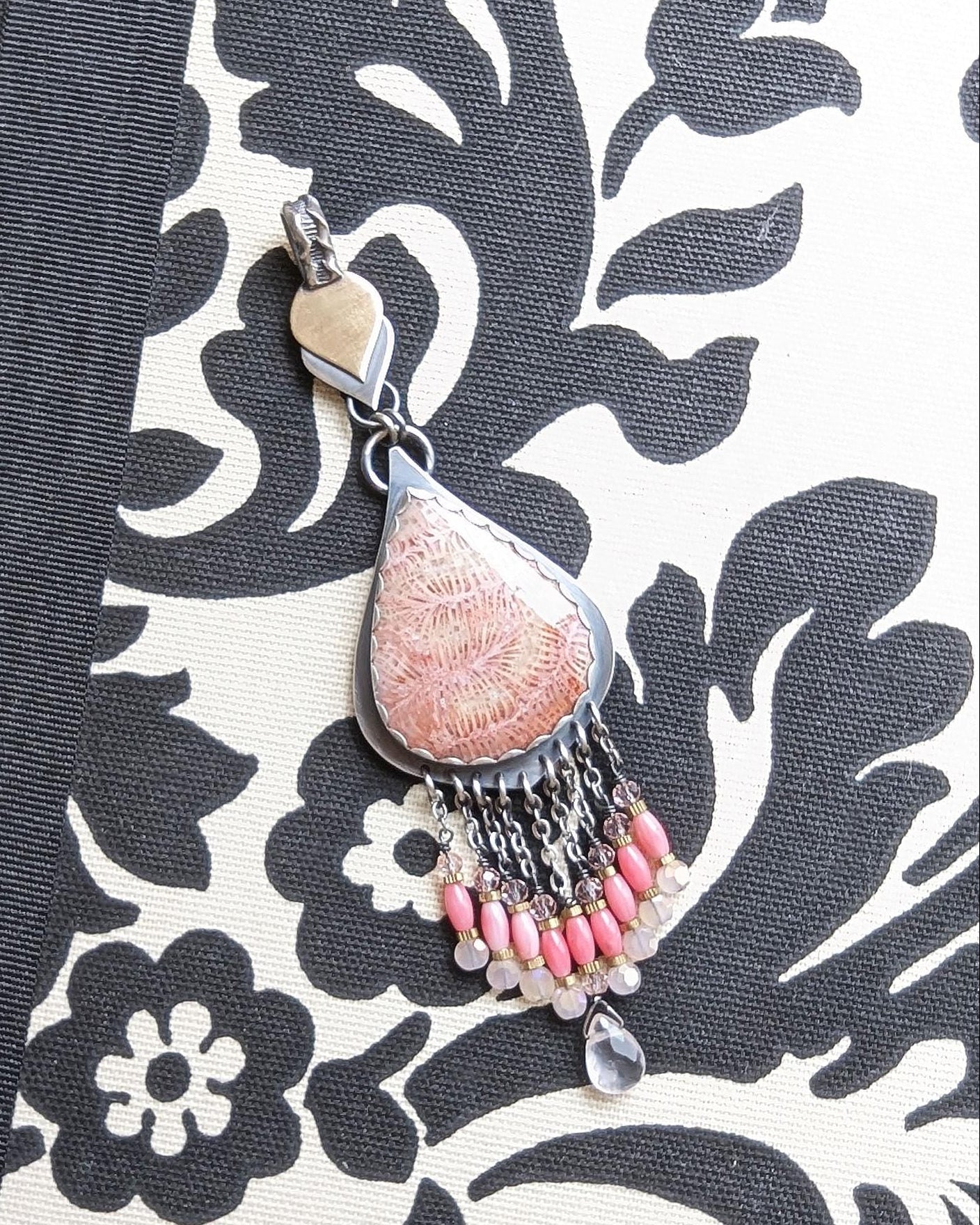 Fossil coral pendant with peach and cream pastel tones