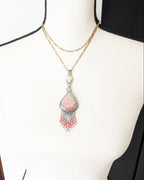 Collector gemstone necklace featuring coral and quartz sparkle on chain and bust for scale (chain not included)