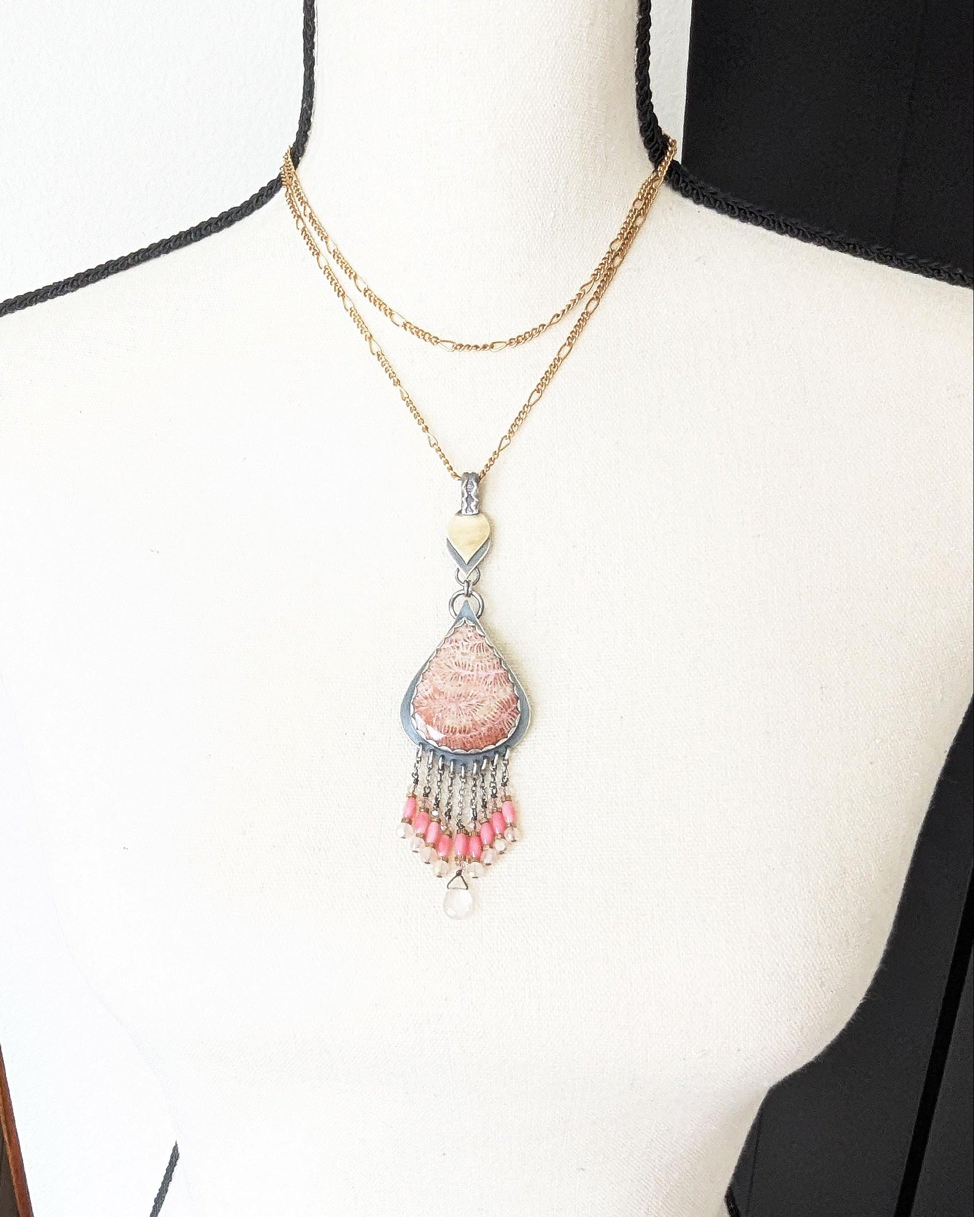 Collector gemstone necklace featuring coral and quartz sparkle on chain and bust for scale (chain not included)