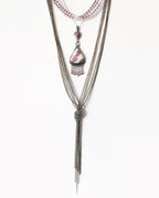 Quartz with natural pink tourmaline crystals accented by moonstone fringe detail shown with layering necklaces ad on chain (not included)