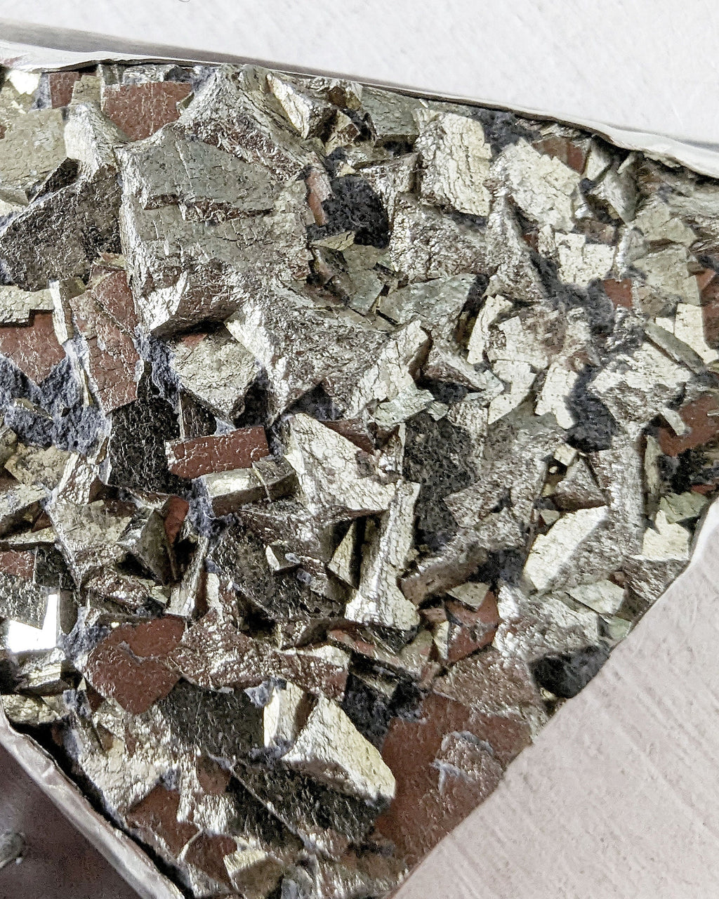 Close up of main pyrite stone in this mixed metal pendant