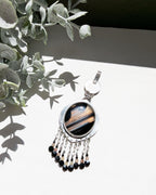 Handcrafted oxidized sterling silver pendant with celestial gemstone design