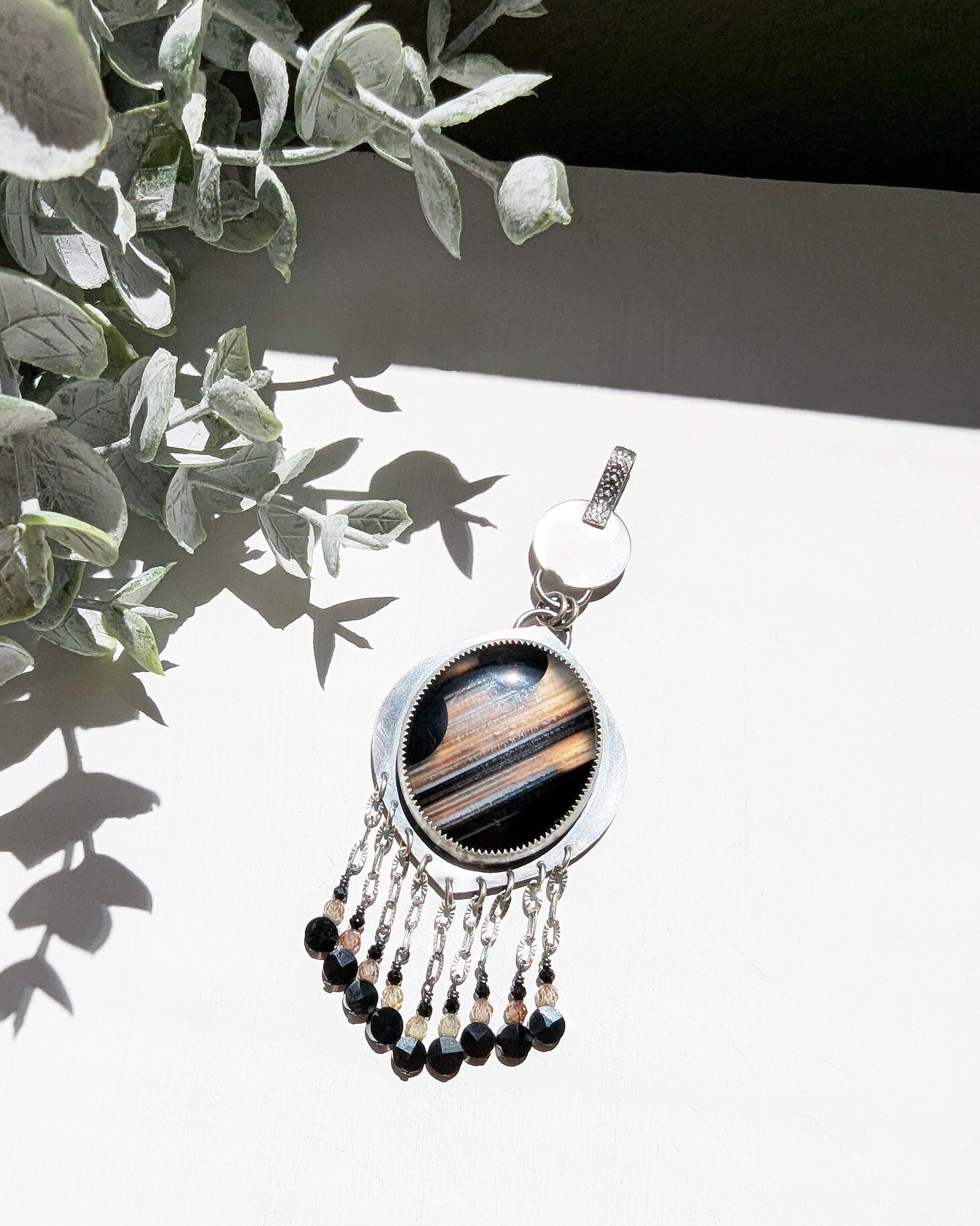 Handcrafted oxidized sterling silver pendant with celestial gemstone design