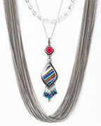 Pink chalcedony and surfite pendant necklace shown on chain with layer necklaces for style (not included)