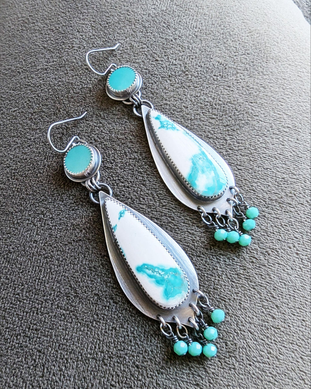 two stone round and teardrop shaped earrings with blue and white stones
