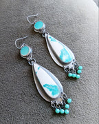 two stone round and teardrop shaped earrings with blue and white stones