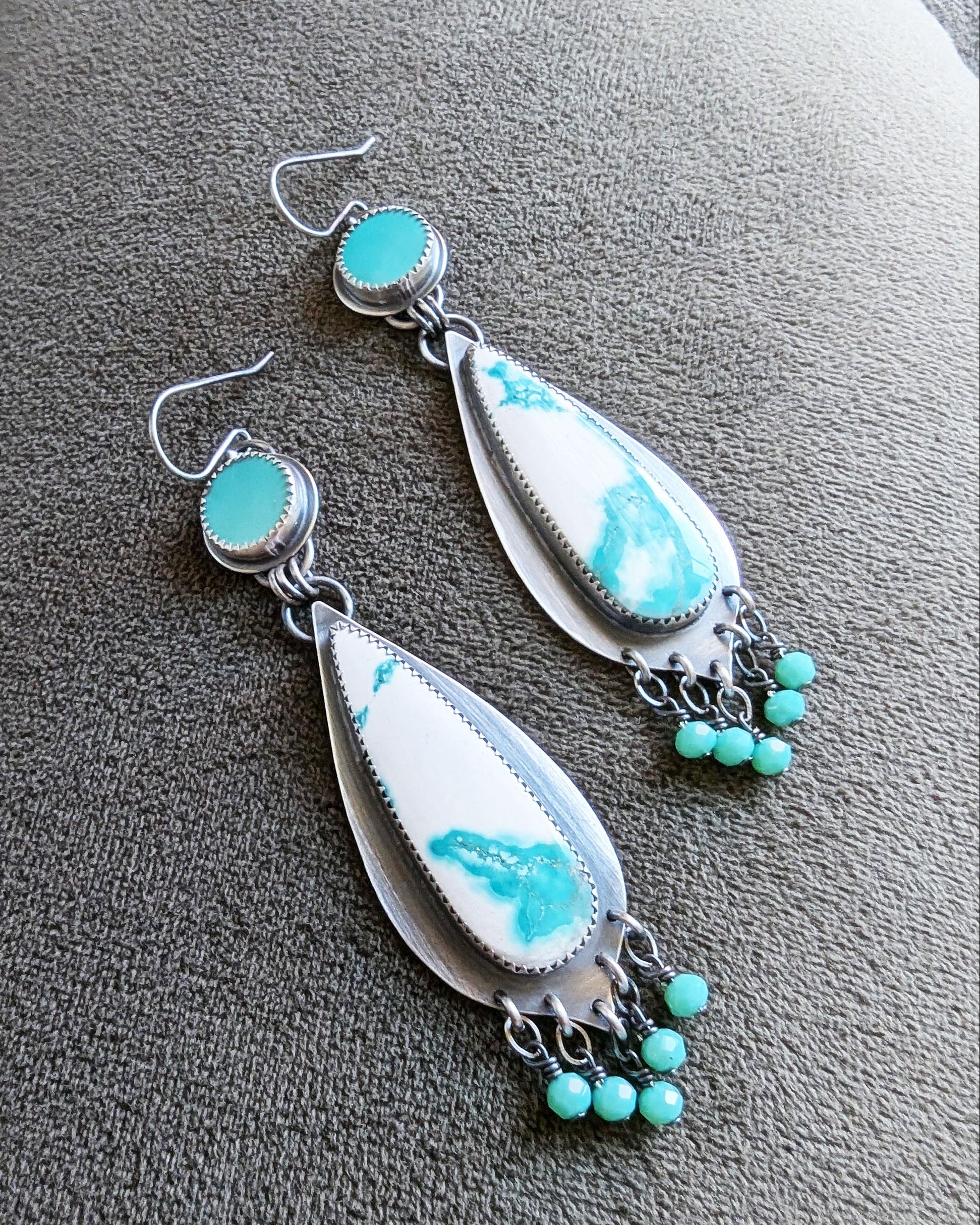 two stone round and teardrop shaped earrings with blue and white stones