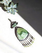 Pear shaped serpentine statement pendant with art deco style design