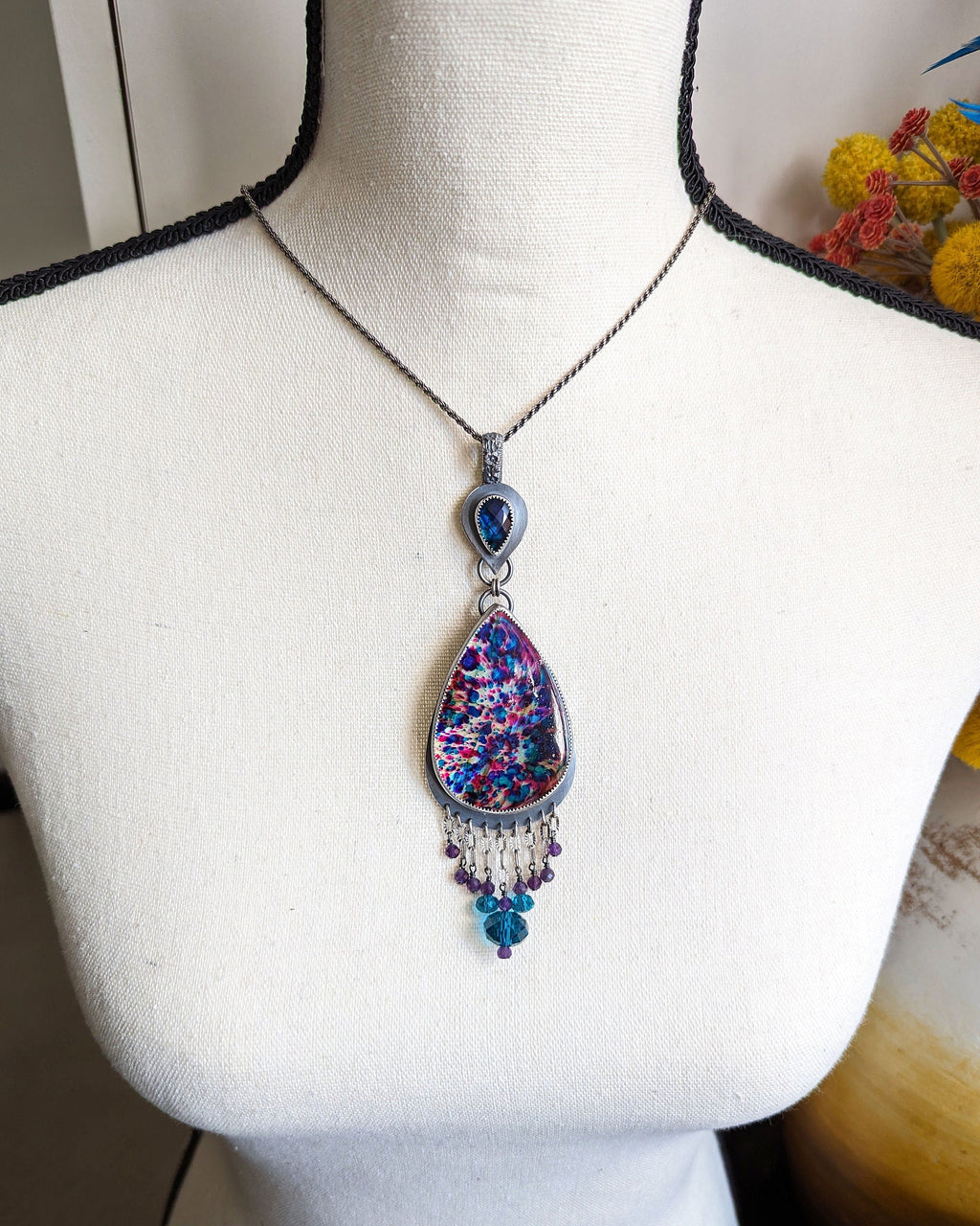 Bold gemstone pendant with abalone quartz and treated labradorite on bust for scale XL