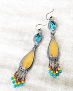 Artisan handmade winter statement earrings with playful color palette