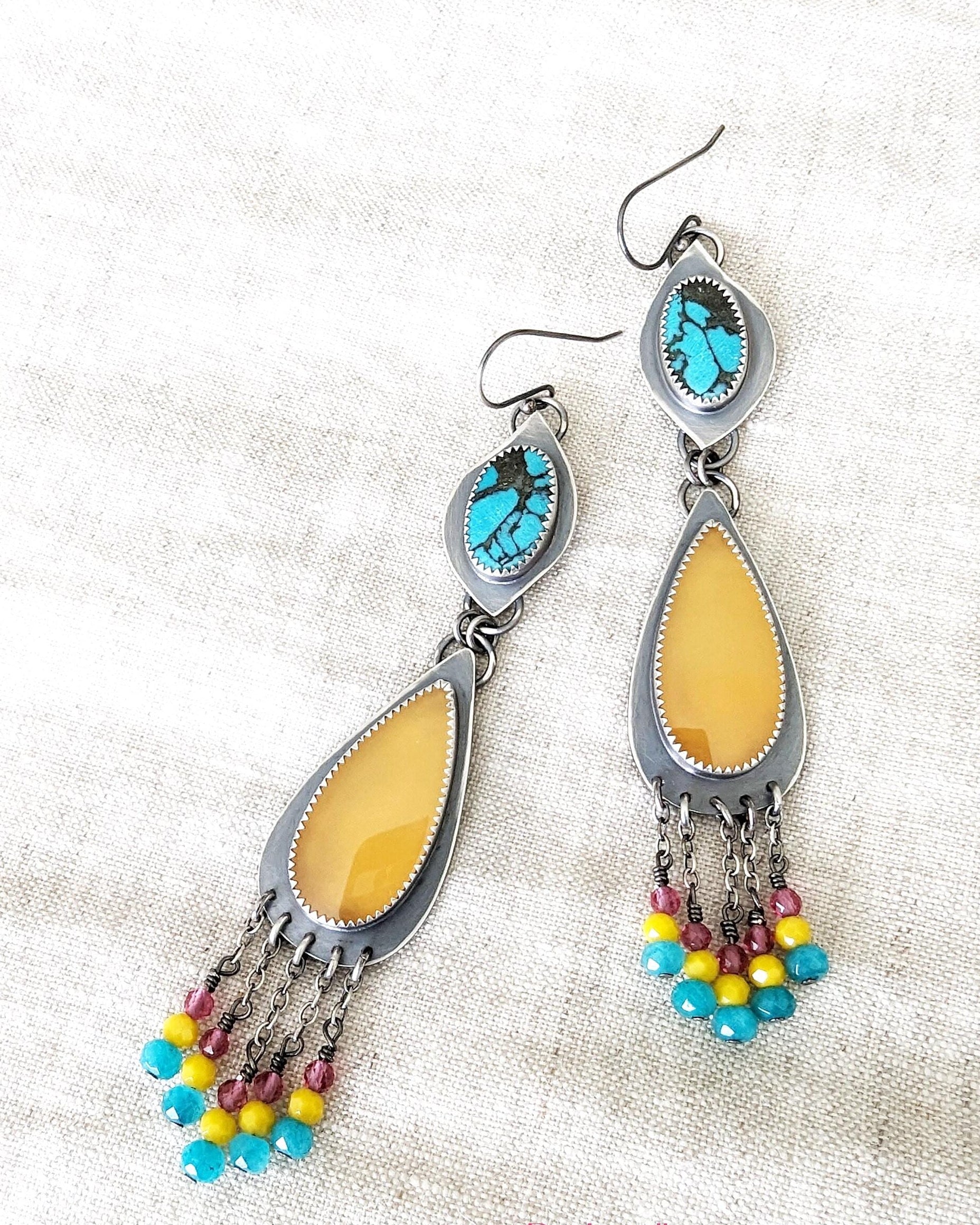 Artisan handmade winter statement earrings with playful color palette